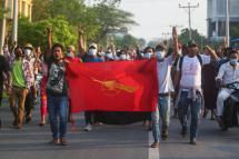  Demonstrators carrying a student union flag march during an anti-military coup protest in Mandalay, Myanmar, 10 May 2021. Photo: EPA