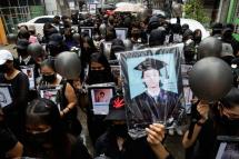 Demonstrators wearing black hold black balloons and pictures of the victims who were shot dead by armed troops as they march during a protest against military coup in Yangon, Myanmar, 05 April 2021. Photo: EPA