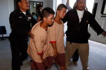 Myanmar migrant workers, who are accused of the killing of two British tourists, Zaw Lin (C-R) and Wai Phyo (C-L) are escorted by a Thai policeman and prison officer after a court verdict sentenced them to death, at the Samui Provincial Court, on Koh Samui Island, Surat Thani province, southern Thailand, 24 December 2015. Photo: Rungroj Yongrit/EPA
