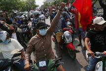 Demonstrators on motorcycles gesture during an anti-military coup protest in Mandalay, Myanmar, 15 April 2021. Photo: EPA