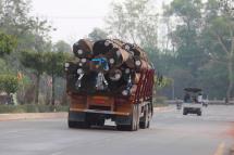 A truck loaded with wood logs drives on the Yangon-Bago road in Bago, Myanmar. Photo: EPA