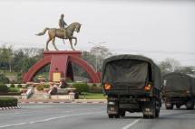 Military trucks drive pass near the roundabout with the statue of General Aung San in Naypyitaw Myanmar, 26 March 2022. Photo: EPA