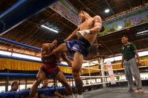 This photo taken on March 5, 2023 show fighters competing in a bout during a traditional Myanmar boxing Lethwei tournament at Pyi Thar Lin Aye pagoda in Hlaingbwe township in Karen state. Photo: AFP