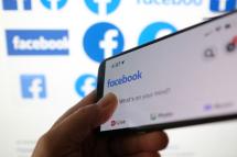 This illustration photo shows a Facebook App logo displayed on a smartphone. Photo: AFP