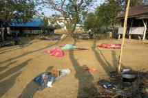 Bodies of policemen, killed in a militant attack, are covered at the Yoetayoke police station, near Sittwe in Rakhine State on March 10, 2019. Photo: AFP