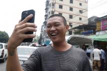 Zaw Tun, a freelance photographer, video calls his friend upon his release from Insein prison in Yangon, Myanmar, 03 May 2023. Photo: EPA