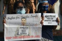 Demonstrators display placards to protest against Philippine President Rodrigo Duterte's decision to pardon US marine Lance corporal Joseph Scott Pemberton who was convicted of killing a transgender woman, during a rally in Manila on September 8, 2020. Photo: AFP
