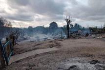 This handout from Pauk Township News taken and shows the remains of houses after they were burnt in Kin Ma village in Pauk Township, Magway region. Photo: AFP