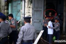 The as yet unidentified suspect at the court (circled). Photo: Mizzima
