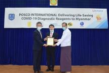 Zaw Than Htun, director general of Myanmar’s Medical Research Center (right), Lee Sang-hwa, South Korea’s ambassador to Myanmar (center), and Lee Sang-hoon, the regional managing director of Posco International, pose in Myanmar on Saturday. Photo: Posco International