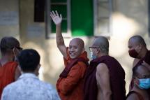 (File) Myanmar nationalist Buddhist monk U Wirathu (C) waves to supporters outside the Yangon western district police station, Yangon, Myanmar, 02 November 2020. Photo: Lynn Bo Bo/EPA