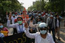 Demonstrators march during an anti-military coup protest in Mandalay, Myanmar, 18 April 2021. Photo: EPA