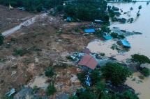 This aerial view shows rescue workers searching for landslide survivors in Thalphyugone village in Paung township, Mon state on August 9, 2019. Photo: Sai Aung Main/AFP