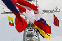 (File) Myanmar's national flag (L) and China's national flag (R) are hoisted on the Chinese Navy training vessel 'Zheng He' as it arrives Myanmar International Terminals Thilawa port of Yangon, Myanmar, 23 May 2014. Photo: Lynn Bo Bo/EPA