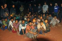 Dozens of Myanmar migrants including several Rohingya have just been arrested in southern Thailand. Here ethnic Rohingya refugees sit waiting after Thai police officers arrested them in Phang Nga province, southern Thailand, October 11, 2014. Photo: EPA
