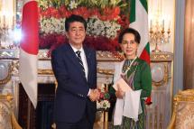 State Counsellor Daw Aung San Suu Kyi shakes hands with Prime Minister of Japan Mr Shinzo Abe at the State Guest House in Tokyo, Japan yesterday. Photo: MNA