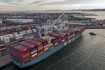 An aerial photo made with a drone shows a ship loaded with containers docked at the Port of Oakland in Oakland, California, USA. Photo: EPA