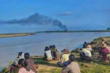 Residents of the Yaelelkyun area watched from afar as the village was being burned