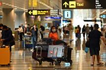 Travellers arrive at Changi International Airport in Singapore on April 1, 2022, as Singapore reopened its land and air borders to travellers fully vaccinated against the Covid-19 coronavirus. Photo: AFP