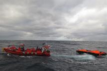 A handout photo made available by the Korean Coast Guard shows members of the Coast Guard engaging in a search and rescue operation in waters 148.2 kilometers southeast of Seogwipo, Jeju Island, South Korea, 25 January 2023, after Jin Tian, a Hong Kong-registered cargo ship carrying 22 crew members, sank off the southern island. EPA-EFE/KOREAN COAST GUARD
