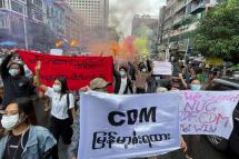  Demonstrators holding posters and banners march during an anti-military coup protest at downtown area in Yangon, Myanmar, 26 June 2021. Photo: EPA