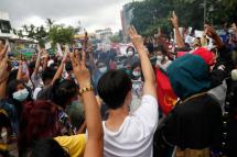 Demonstrators flash three-finger salute during an anti-military coup protest in Yangon, Myanmar, 03 July 2021. Photo: EPA
