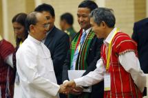 Myanmar president Thein Sein (L) shakes hand with a member of the Karen delegation (R) before a meeting with ethnic armed groups leaders to discuss the signing of a Nationwide Ceasefire Agreement (NCA) at the Myanmar International Convention Center (MICC) in the capital Naypyitaw, Myanmar, 9 September 2015. Photo: Lynn Bo BO/EPA
