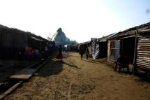 People walk around the Thet Kel Pyin internally displaced persons (IDP) camp in Sittwe, Rakhine State. Photo: EPA