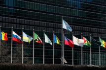 The United Nations flag is seen over countries flags outside the United Nations Headquarters in New York, New York, USA. Photo: EPA