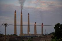 Smokestacks belch noxious fumes into the air from a massive coal-fired power plant on the Indonesian coast, a stark illustration of Asia's addiction to the fossil fuel which is threatening climate targets. PHOTO: AFP