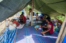 Myanmar refugees and their children, who fled a surge in violence as the military cracks down on rebel groups, at a camp in Nawphewlawl near the Myanmar-Thailand border in Kayin state. Photo: AFP
