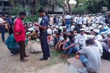  Policeman takes the details of Rohingya refugees who were detained from a beach, at the Sadar Model police station in Cox's Bazar. Bangladesh police detained at least 450 Rohingya refugees as they celebrated the Muslim festival of Eid on a popular beach, officials said on May 5, 2022. Photo: AFP
