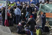 Ukrainians flee. Photo: AFP