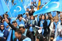 Ethnic Uighurs take part in a protest march asking for the European Union to call upon China to respect human rights in the Chinese Xinjiang region. Photo: AFP