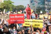 Demonstrators hold placards and a cutout with the image of Aung San Suu Kyi during a protest against the military coup in Yangon, Myanmar.Photo: (Reuters) 
