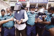 Police escort two Islamist extremists after a court sentenced them to death over the brutal murder of Dhaka University professor and award-winning author Humayun Azad, in Dhaka on April 13, 2022. Photo: AFP