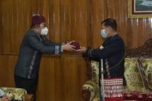 Kachin chief minister Khet Htein Nan presents Kachin traditional items to Senior General Min Aung Hlaing. Photo: Irrawaddy