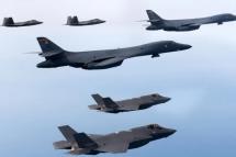 This handout photo taken on February 1, 2023 and provided by the South Korean Defence Ministry in Seoul shows two US Air Force B-1B strategic bombers (C), South Korean Air Force F-35 fighter jets (bottom) and US Air Force F-22 stealth fighter jets flying over the Yellow Sea, located between China and the Korean peninsula, during a joint air drill. Photo: South Korean Defence Ministry/AFP