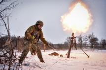 Ukrainian serviceman of the " 24 separate mechanized brigade named after King Danylo" fires a mortar towards Russian positions, at an undisclosed location, Donetsk region, eastern Ukraine, 17 February 2023. Photo: EPA