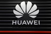 Huawei logo is seen at the Huawei Customer Experience Centre where 5G technology devices are displayed. Photo: EPA