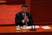 Chinese President Xi Jinping applauds during the commending meeting for Beijing, China. Photo: EPA