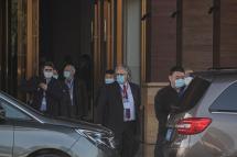 Members of World Health Organization (WHO) gather to leave a Hilton hotel, in Wuhan, China, 29 January 2021. Photo: EPA