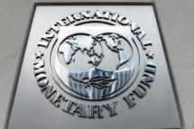 In this file photo an exterior view of the building of the International Monetary Fund (IMF), with the IMG logo, is seen on March 27, 2020 in Washington, DC. Olivier DOULIERY / AFP