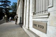 In front of the entrance of the World Trade Organization (WTO) headquarter in Geneva (Switzerland). Photo: AFP