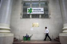 A man walks in front if the Yangon Stock Exchange building in Yangon. Photo: Ye Aung Thu/AFP