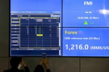 (File) An electronic board showing the FMI (First Myanmar Investment) index at Yangon Stock Exchange in Yangon on 25 March 2016. Photo: Hlaing Myo Htun/Mizzima