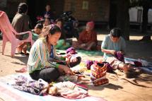 A group of women sewing traditional Kachin headgear to earn income at the Zi Un displacement camp in Myitkyina on Jan 7, 2016. The task is painstaking - it takes 40 to 50 minutes to finish one headpiece, for which they receive 100 kyats ($0.08). (PHOTO:- Thin Lei Win/Myanmar Now)
